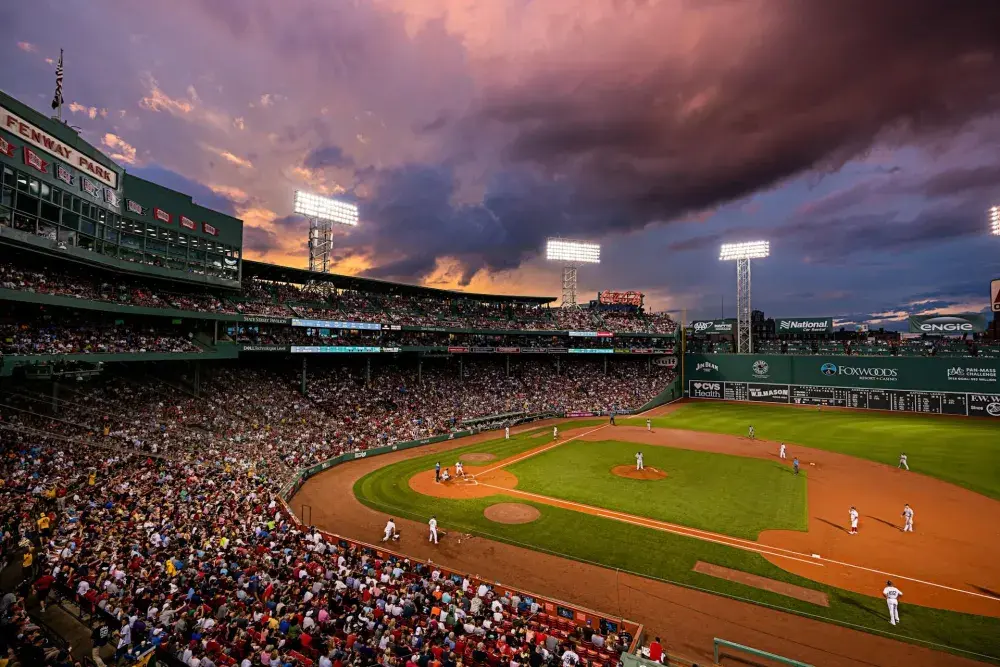 A baseball game under some dramatic weather at Fenway Park, Boston
