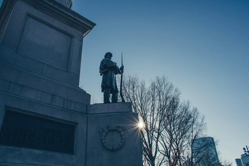 The Bunker Hill Monument statue of a soldier holding a rifle in Charlestown, commemorating the 1775 battle